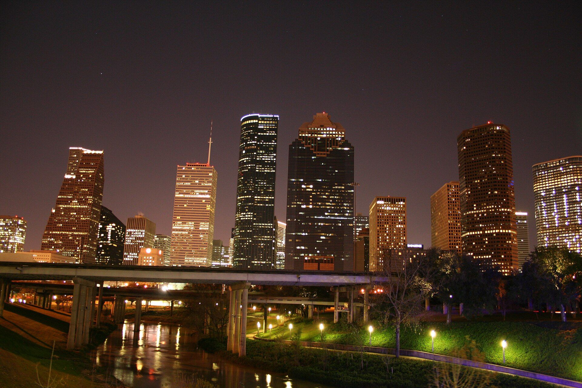 Downtown Houston skyline at night — glass and steel towers